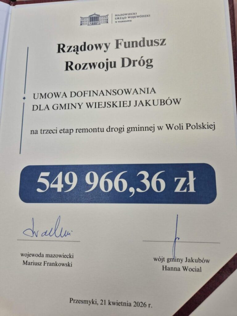 Dokument na białym tle to umowa dofinansowania z kwotą 549 966,36 zł. W nagłówku widnieje „Rządowy Fundusz Rozwoju Dróg”. Jest podpisany przez wojewodę mazowieckiego i wójta gminy Jakubów.