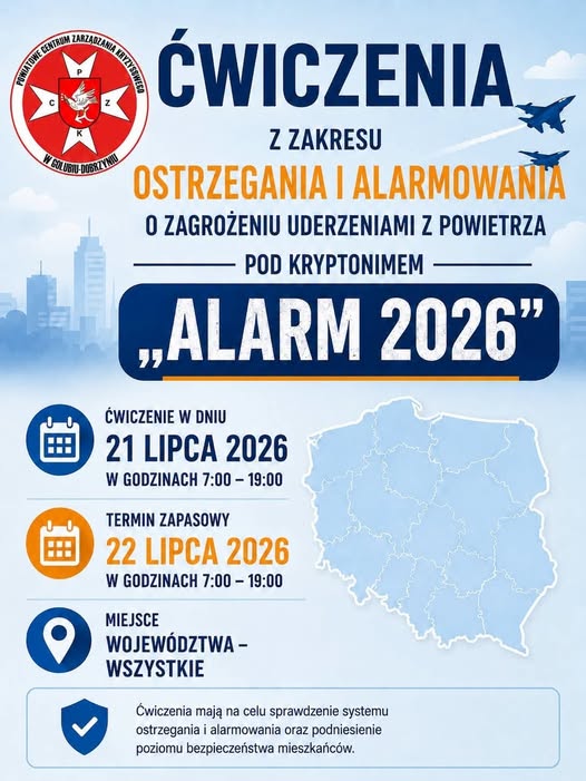 Plakat informuje o ćwiczeniach alarmowych 21 lipca 2026. Tło niebieskie z mapą Polski i grafiką miasta. U góry logo instytucji i myśliwce.